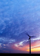 Image:  Silhouette of wind turbine against sunset sky